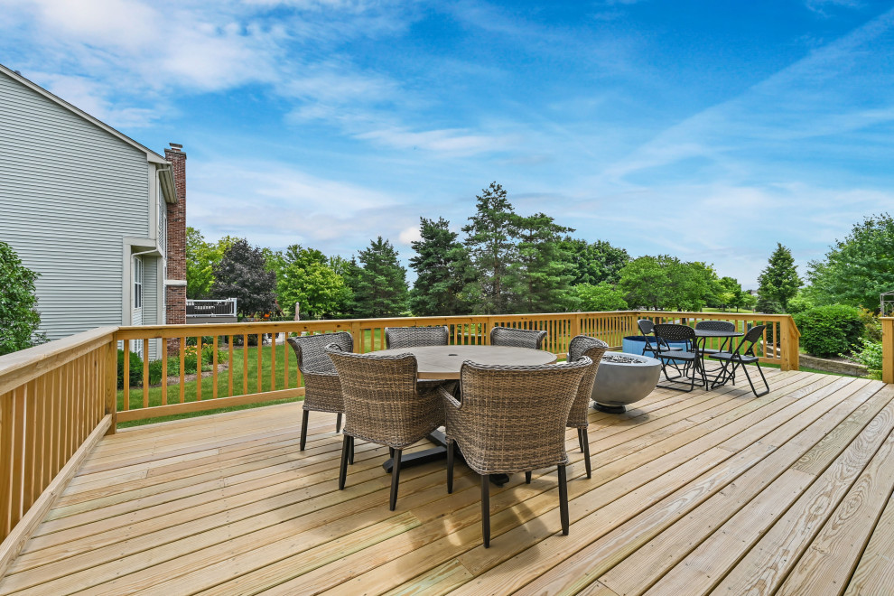 Backyard wood railing deck photo in Chicago