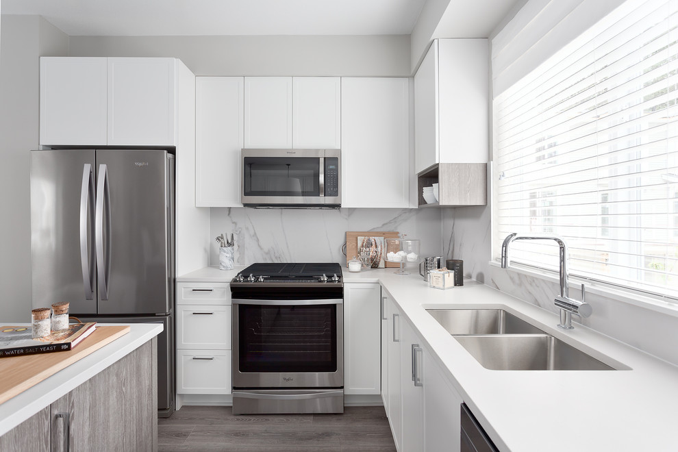 Example of a transitional kitchen design in Vancouver