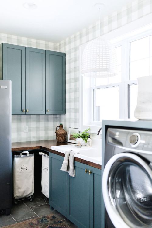 Classic cottage laundry room features a white and gray granite