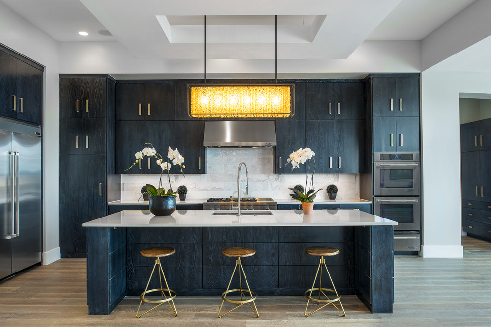 Photo of a contemporary kitchen in Austin with flat-panel cabinets, with island and black cabinets.