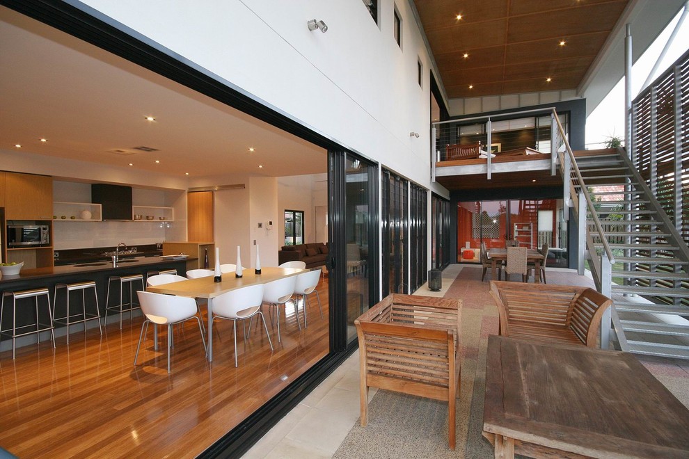 Inspiration for a large contemporary side yard deck in Sunshine Coast with a roof extension.