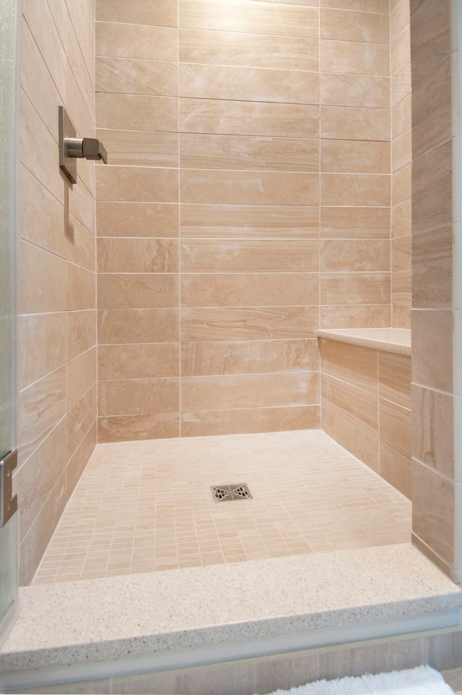 Design ideas for a mid-sized modern master bathroom in Columbus with shaker cabinets, medium wood cabinets, an alcove shower, a two-piece toilet, beige tile, porcelain tile, beige walls, porcelain floors, an undermount sink and engineered quartz benchtops.