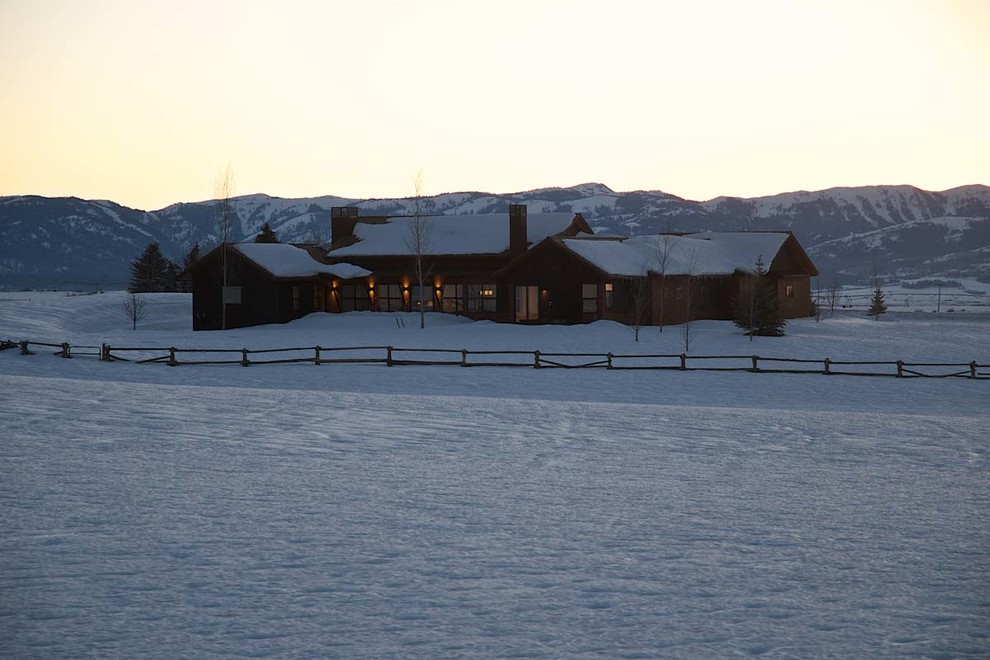 Large mountain style brown two-story wood gable roof photo