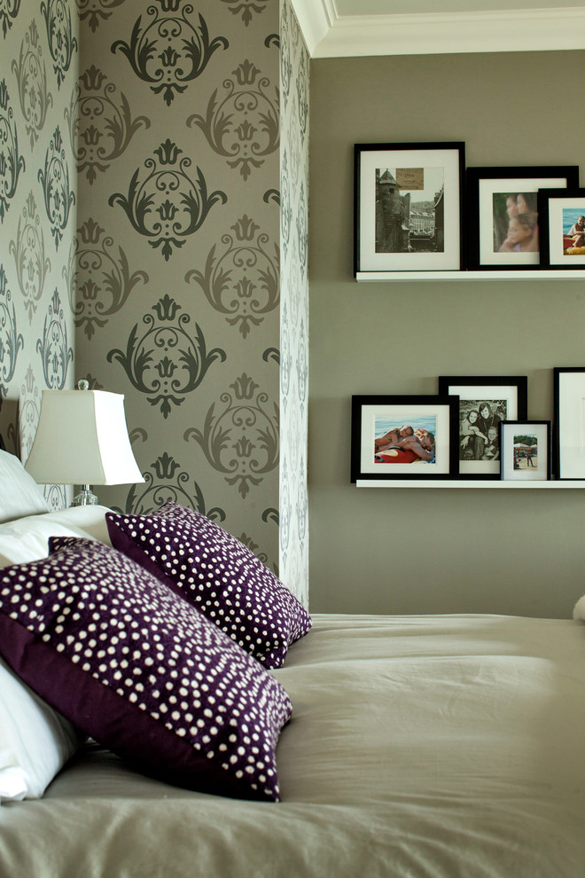 This is an example of a transitional master bedroom in Toronto with grey walls and carpet.