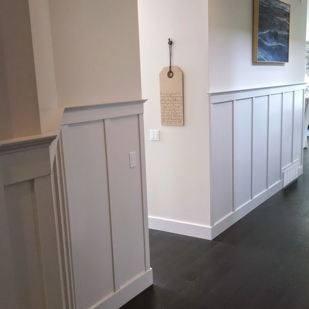 Design ideas for a hallway in Grand Rapids with white walls.