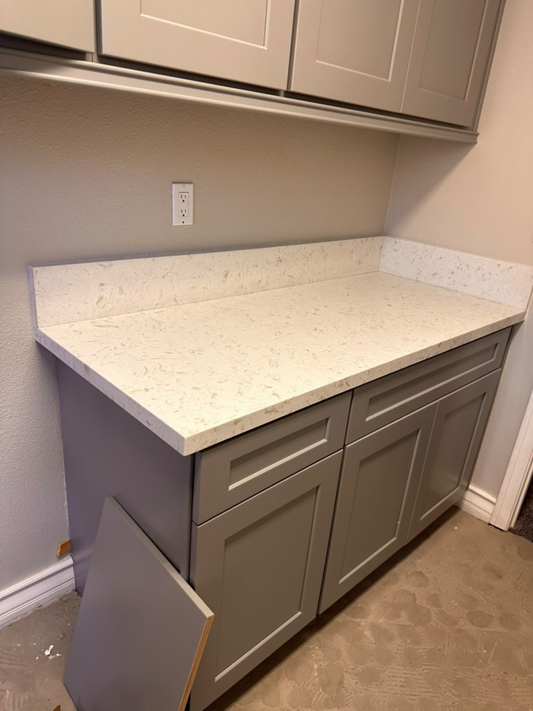 Tile plank install / laundry room cabinetry