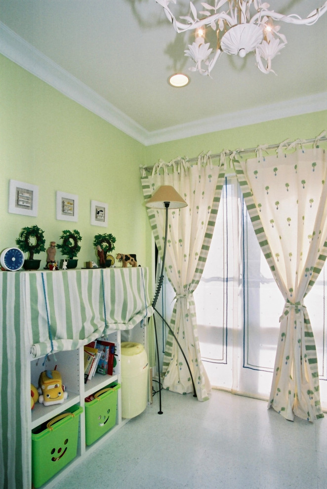 This is an example of a small country toddler’s room for girls in Other with green walls, cork flooring, white floors, a wallpapered ceiling and tongue and groove walls.