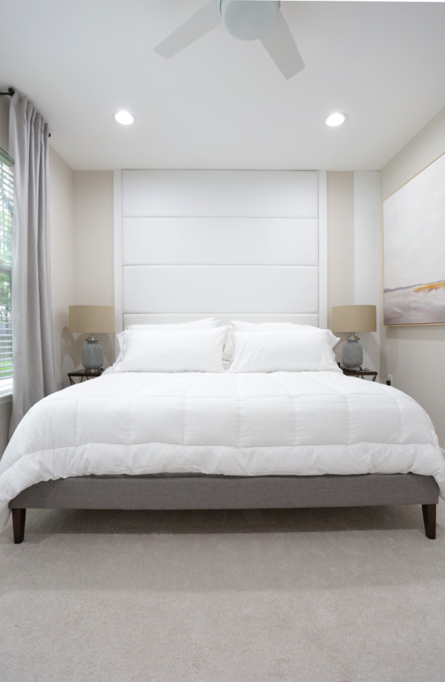 Photo of a mid-sized beach style master bedroom in DC Metro with white walls, carpet and white floor.