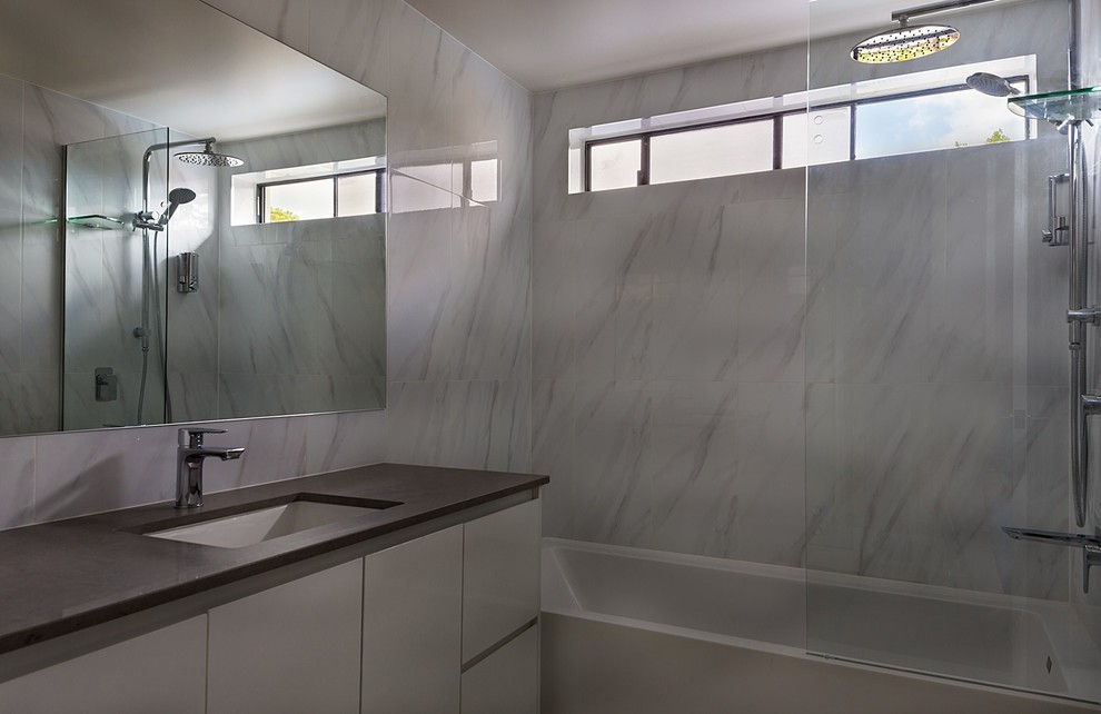 Small modern bathroom in Sunshine Coast with an open shower, white tile, ceramic tile, white walls, ceramic floors, an undermount sink, solid surface benchtops, white floor and an open shower.