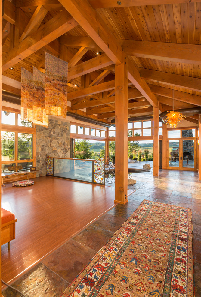 Inspiration for an expansive country living room in Denver with light hardwood floors.