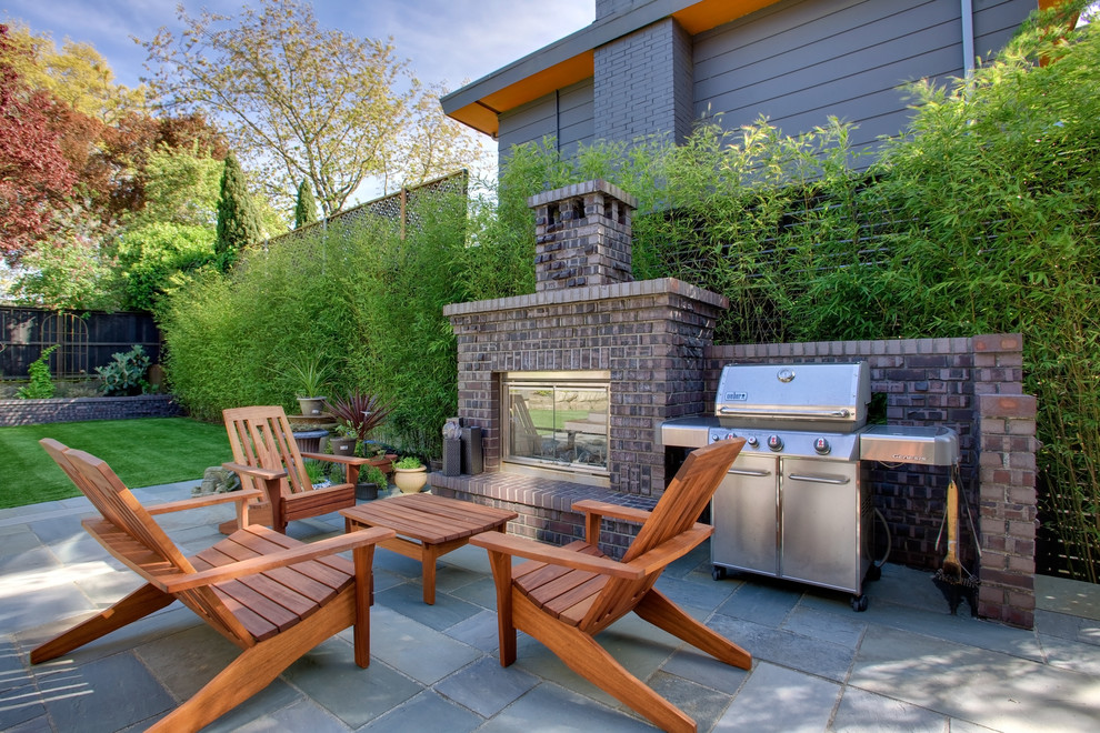 This is an example of an arts and crafts backyard patio in Seattle.