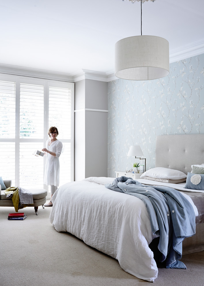 Large eclectic bedroom in Melbourne with grey walls and carpet.