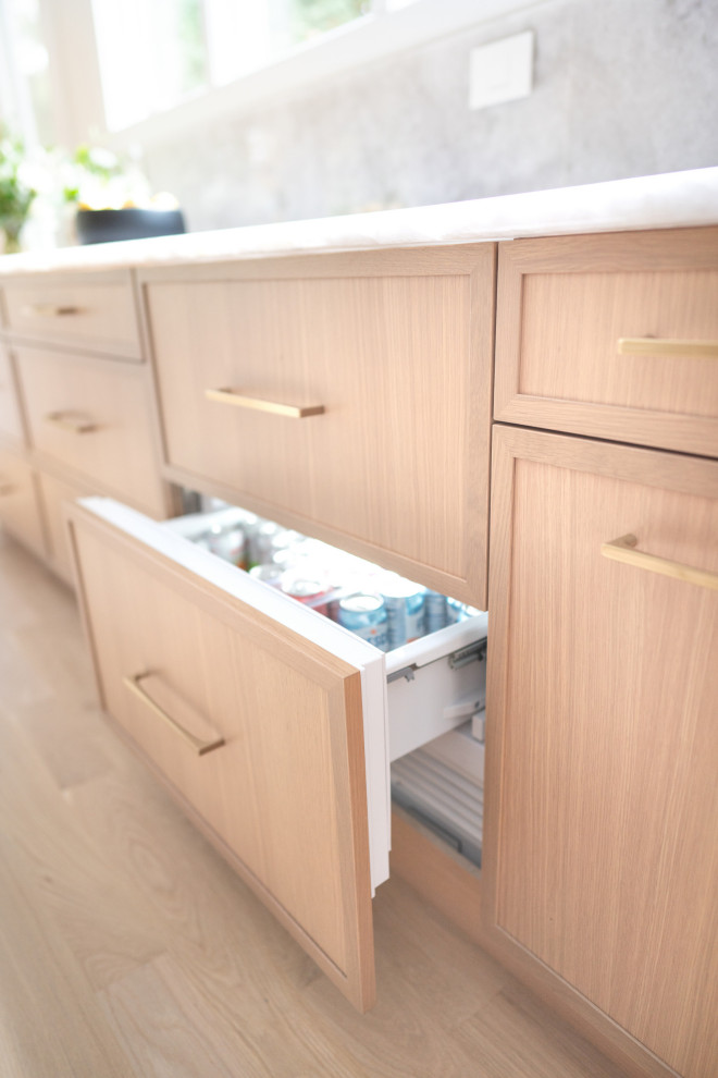 Light Oak Modern Kitchen With Seamless Storage & Calacatta Quartz Surfaces