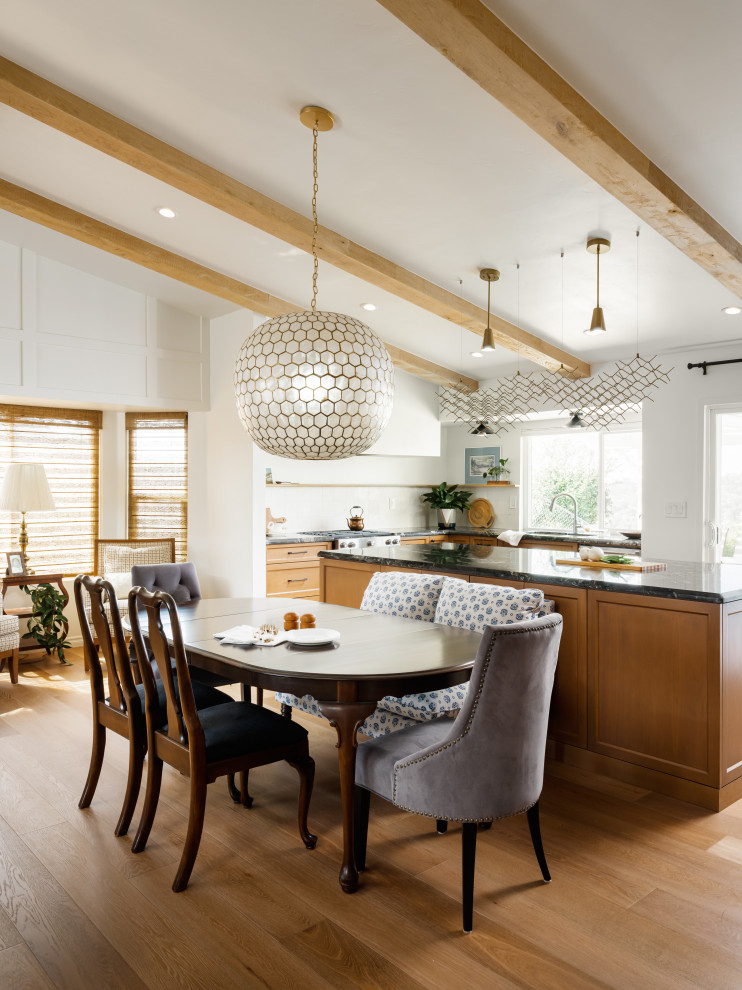 Design ideas for a mid-sized transitional open plan dining in San Diego with light hardwood floors, beige floor and exposed beam.