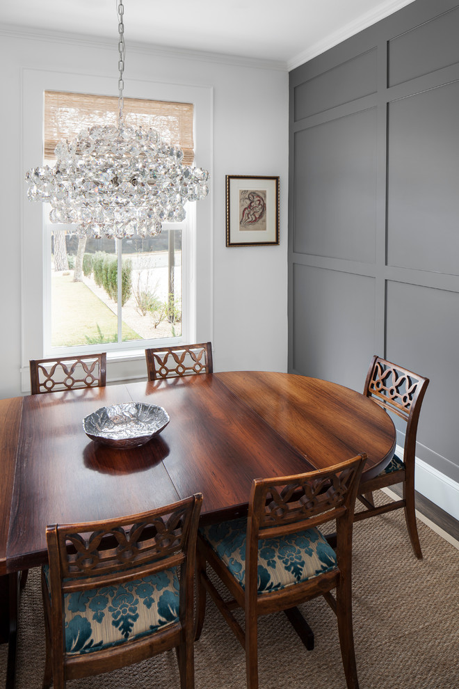 This is an example of a transitional separate dining room in Austin with grey walls, dark hardwood floors and no fireplace.