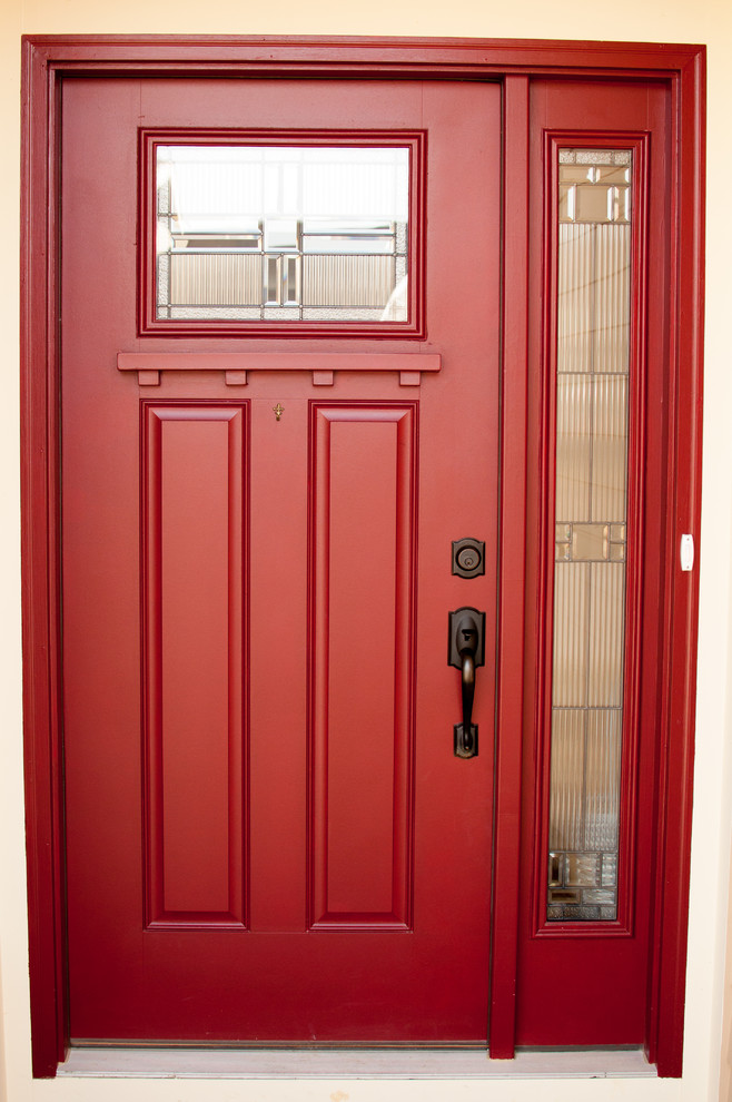 This is an example of a mid-sized arts and crafts front door in Cincinnati with a single front door and a red front door.