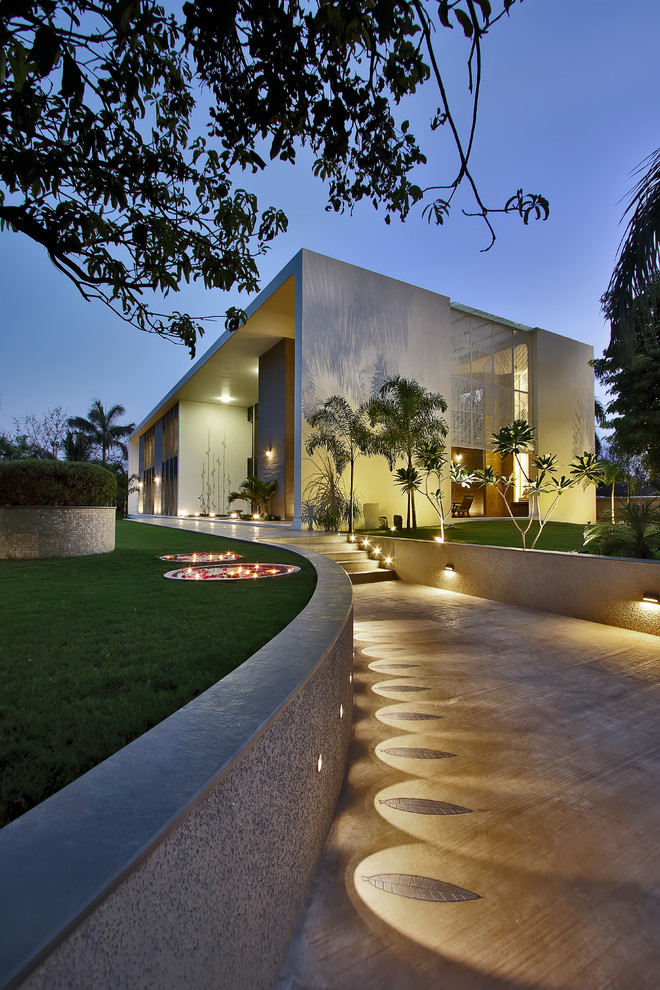 Large contemporary exterior in Ahmedabad with a flat roof.
