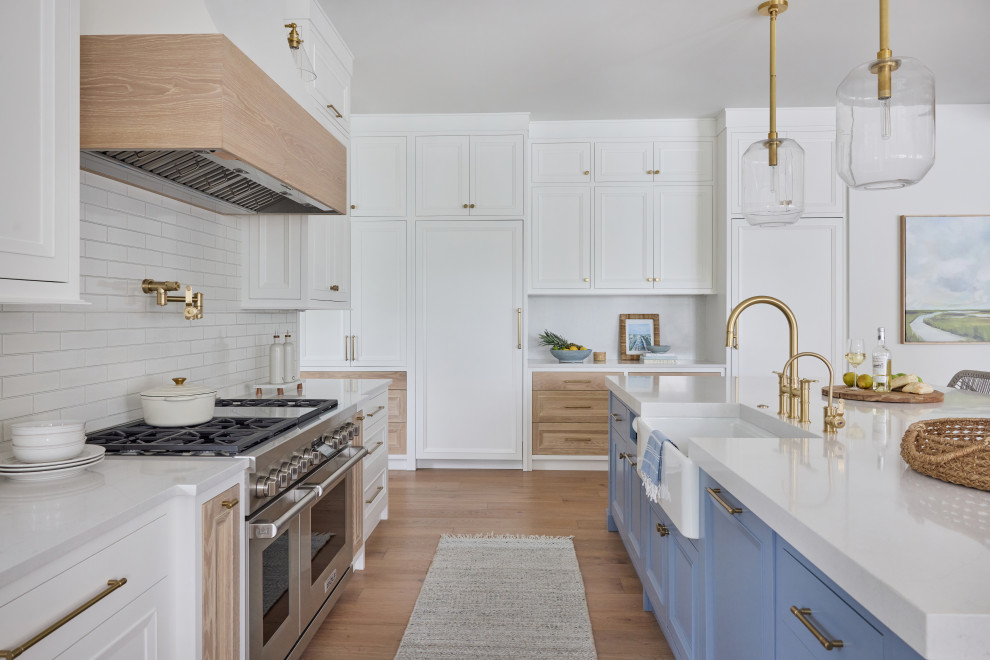 2 Chicks Happy Family Home - Custom Kitchen with Blue Island, Brass Hardware, and white oak accents. A bright, hardworking custom kitchen by 2 Chicks Design Co in a Ponte Vedra Beach new home. A painted blue island contrasts crisp white perimeter cabinetry with white oak accent drawer fronts, with brass hardware, a sculptural range hood, and warm oak flooring layered for everyday family living.
Tags: Transitional Kitchen, Coastal Kitchen, Blue Island, Brass Hardware, Plaster Hood, Two-Tone Cabinetry, White Cabinets