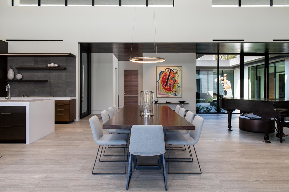 Photo of a large modern open plan dining in Las Vegas with white walls, no fireplace, porcelain floors and grey floor.