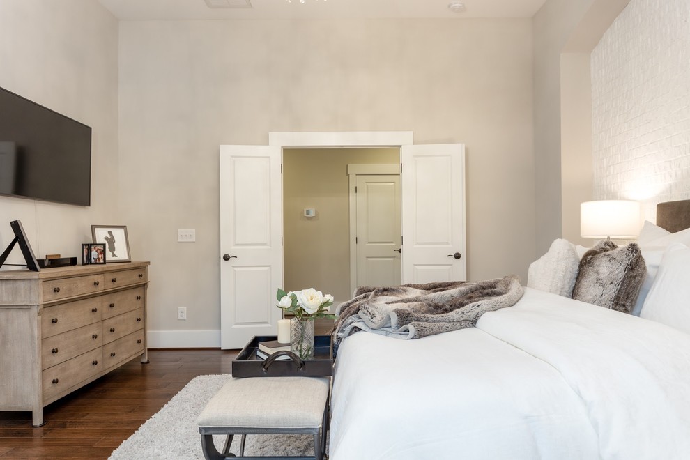 Inspiration for a transitional master bedroom in Raleigh with beige walls, medium hardwood floors and brown floor.