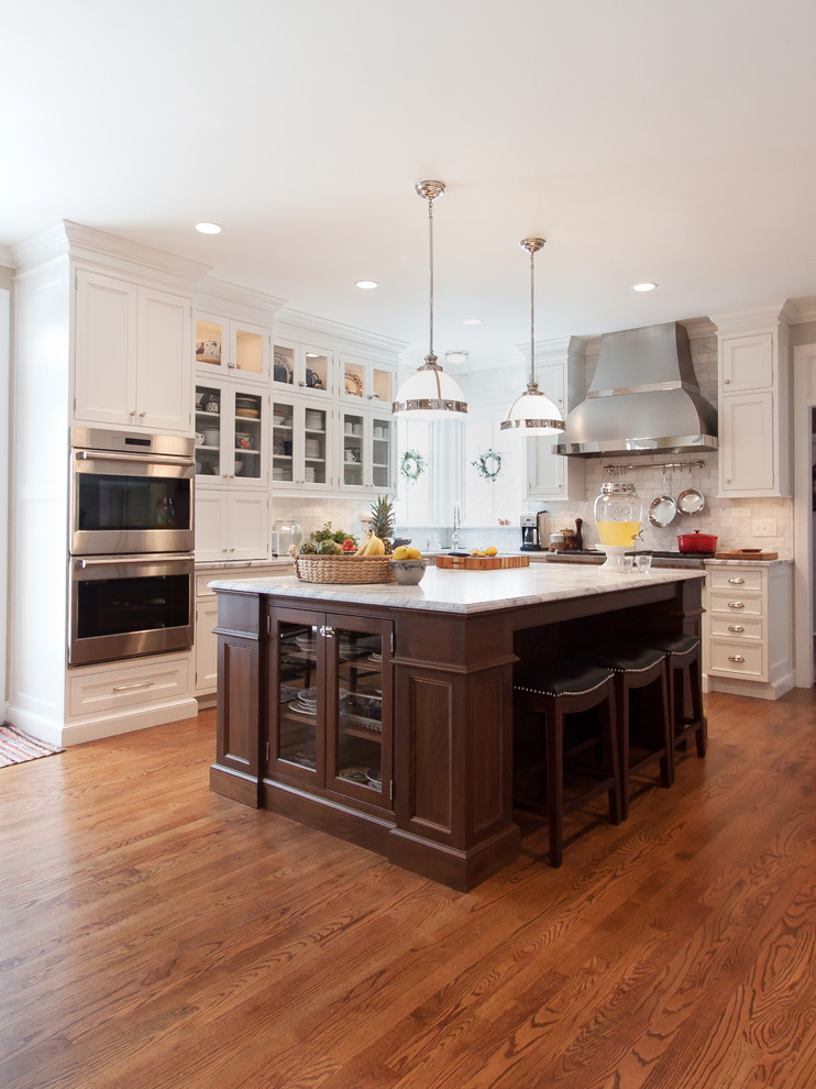 Inspiration for a large transitional kitchen remodel in DC Metro with beaded inset cabinets, white cabinets, marble countertops, white backsplash, subway tile backsplash, stainless steel appliances and an island