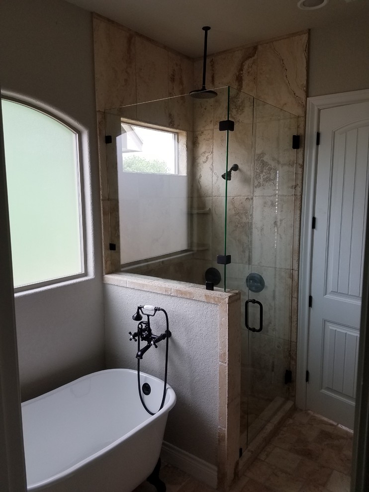 Inspiration for a mid-sized traditional master bathroom in Austin with shaker cabinets, dark wood cabinets, a claw-foot tub, an alcove shower, a one-piece toilet, beige tile, brown tile, ceramic tile, grey walls, ceramic floors, an undermount sink and granite benchtops.