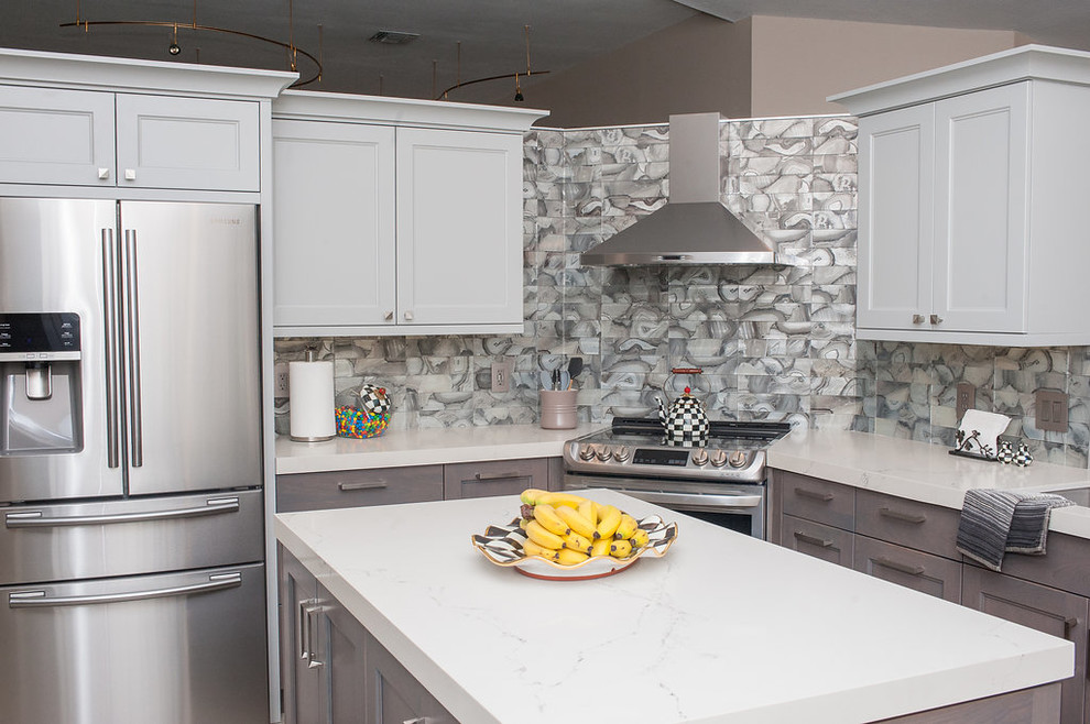 Mid-sized transitional u-shaped porcelain tile and beige floor eat-in kitchen photo in Miami with an undermount sink, shaker cabinets, gray cabinets, quartz countertops, gray backsplash, glass tile backsplash, stainless steel appliances, an island and white countertops