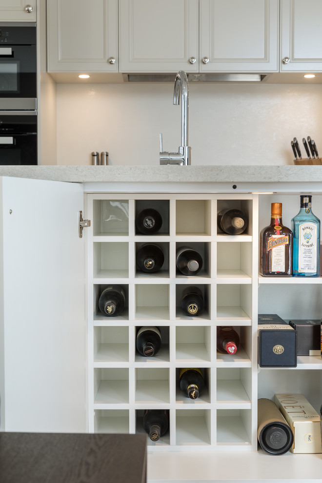 Inspiration for a modern kitchen in Perth with shaker cabinets, beige cabinets, quartz benchtops, beige splashback, ceramic splashback, stainless steel appliances and beige benchtop.