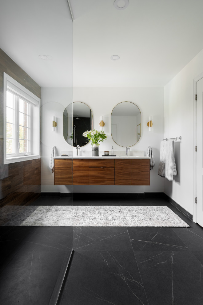Medium sized contemporary ensuite bathroom in Montreal with flat-panel cabinets, dark wood cabinets, a built-in shower, a one-piece toilet, brown tiles, wood-effect tiles, white walls, a submerged sink, engineered stone worktops, an open shower, white worktops, double sinks and a floating vanity unit.