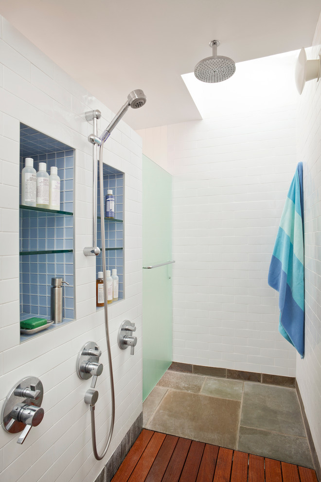 This is an example of a contemporary bathroom in San Francisco with a curbless shower, white tile and subway tile.