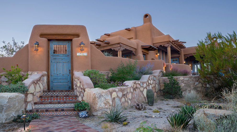 This is an example of a southwestern full sun brick garden path in Albuquerque.