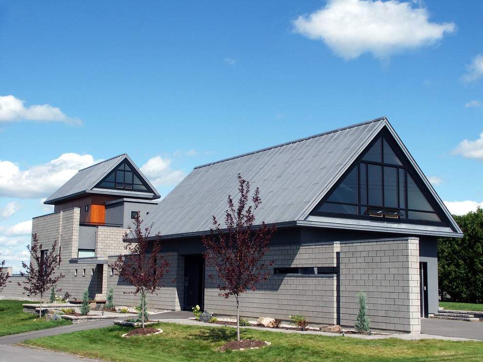 Design ideas for a contemporary grey exterior in Ottawa.