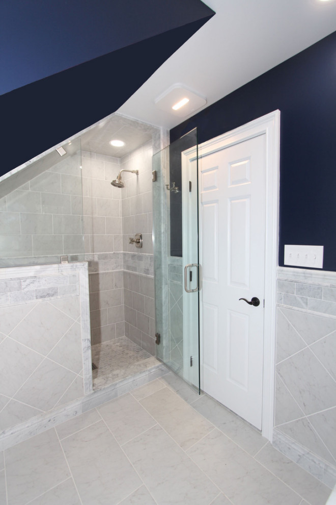 Inspiration for a mid-sized traditional bathroom in Baltimore with shaker cabinets, dark wood cabinets, an alcove shower, a two-piece toilet, white tile, ceramic tile, blue walls, ceramic floors, a drop-in sink, marble benchtops, white floor, a hinged shower door, white benchtops, a shower seat, a single vanity and a freestanding vanity.