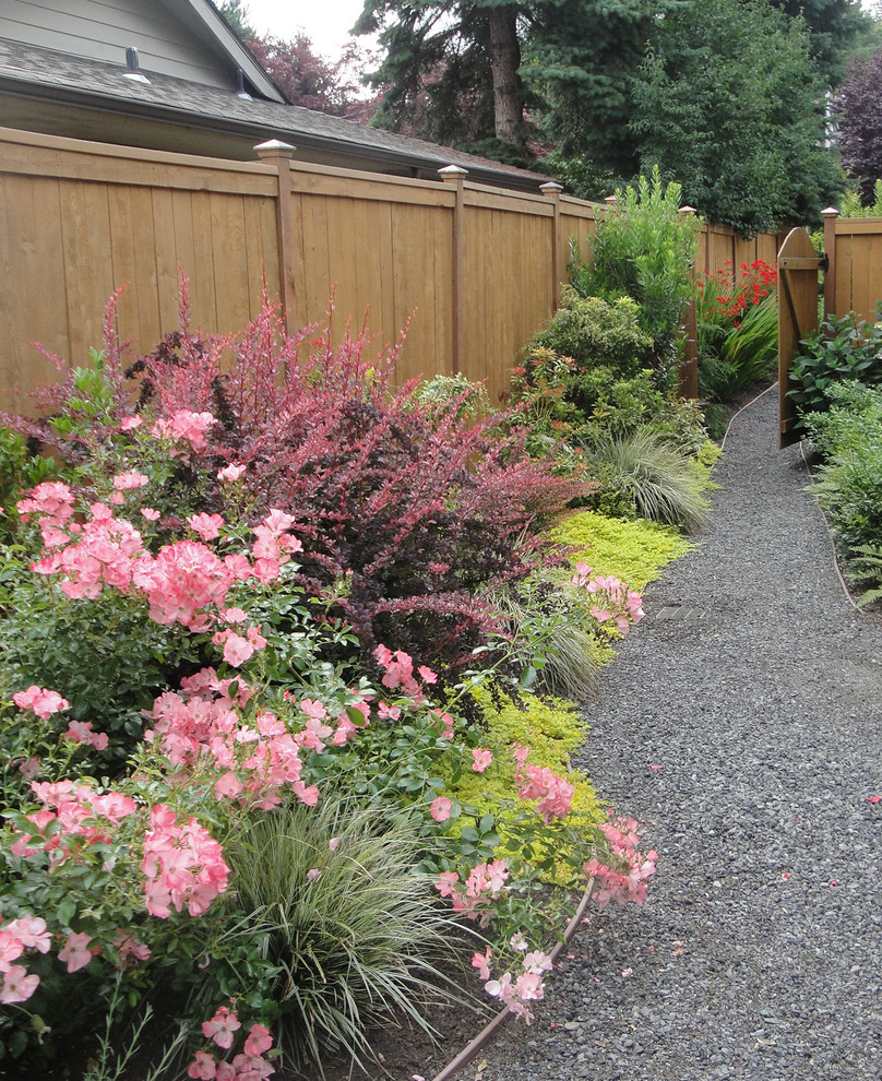 Inspiration for a mid-sized arts and crafts backyard partial sun garden for spring in Seattle with a garden path and decomposed granite.