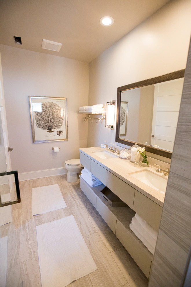 Inspiration for a small modern master bathroom in Wilmington with flat-panel cabinets, beige cabinets, gray tile, ceramic tile, white walls, cement tiles, a wall-mount sink and engineered quartz benchtops.