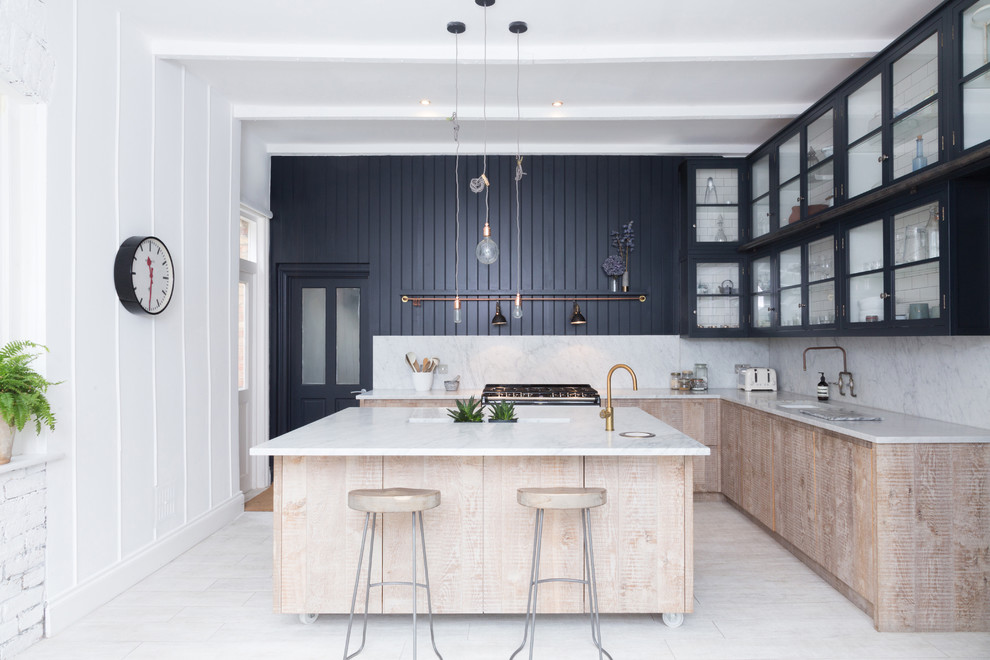 Photo of a scandinavian l-shaped kitchen in Sydney with an undermount sink, flat-panel cabinets, light wood cabinets, marble benchtops, white splashback, stone slab splashback and with island.