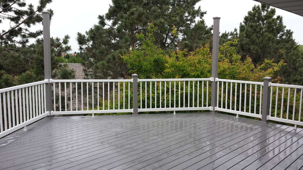 Deck - mid-sized modern deck idea with an awning