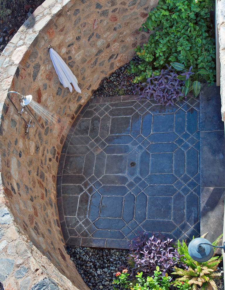 Photo of a large backyard patio in Phoenix with tile, a pergola and an outdoor shower.