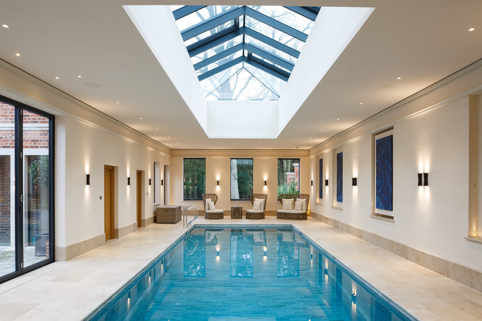 Inspiration for a transitional indoor rectangular pool in Essex with tile.