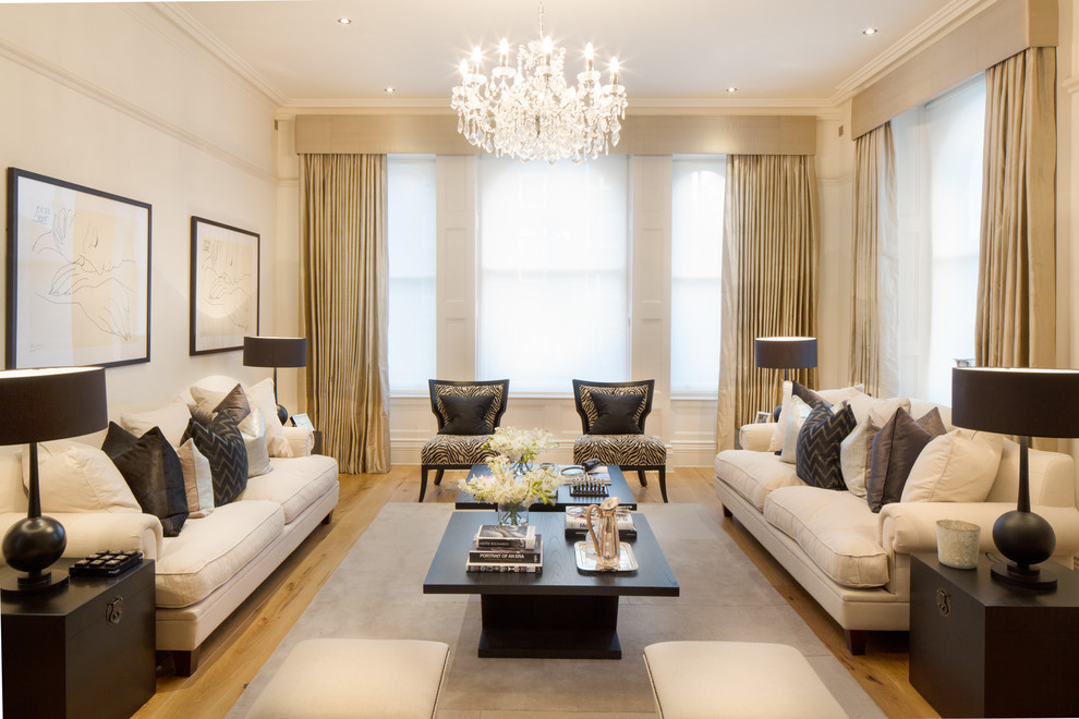 Design ideas for a transitional formal living room in London with beige walls and light hardwood floors.