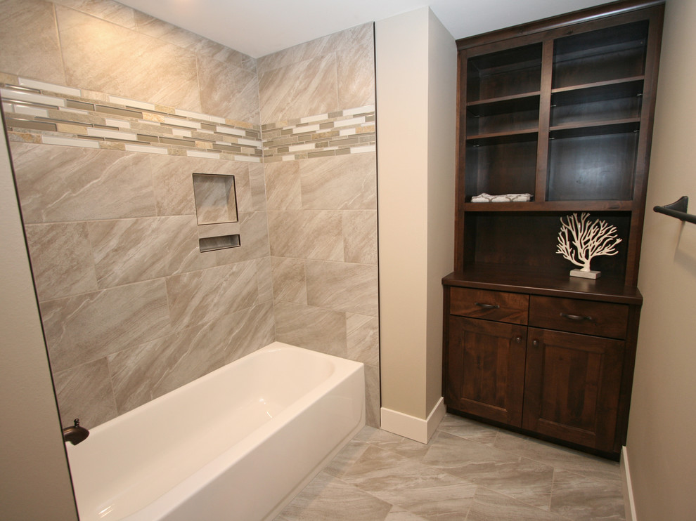 Example of a mid-sized mountain style kids' beige tile and porcelain tile porcelain tile home design design in Seattle with shaker cabinets, dark wood cabinets, a two-piece toilet, beige walls, a vessel sink and granite countertops