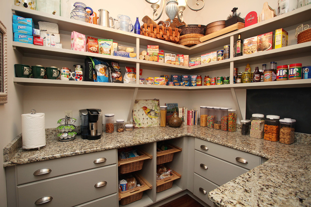 Design ideas for a traditional kitchen pantry in Charlotte with open cabinets.