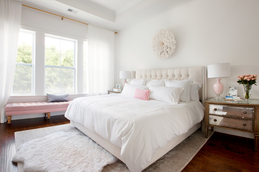 Design ideas for a traditional master bedroom in Charleston with white walls and medium hardwood floors.