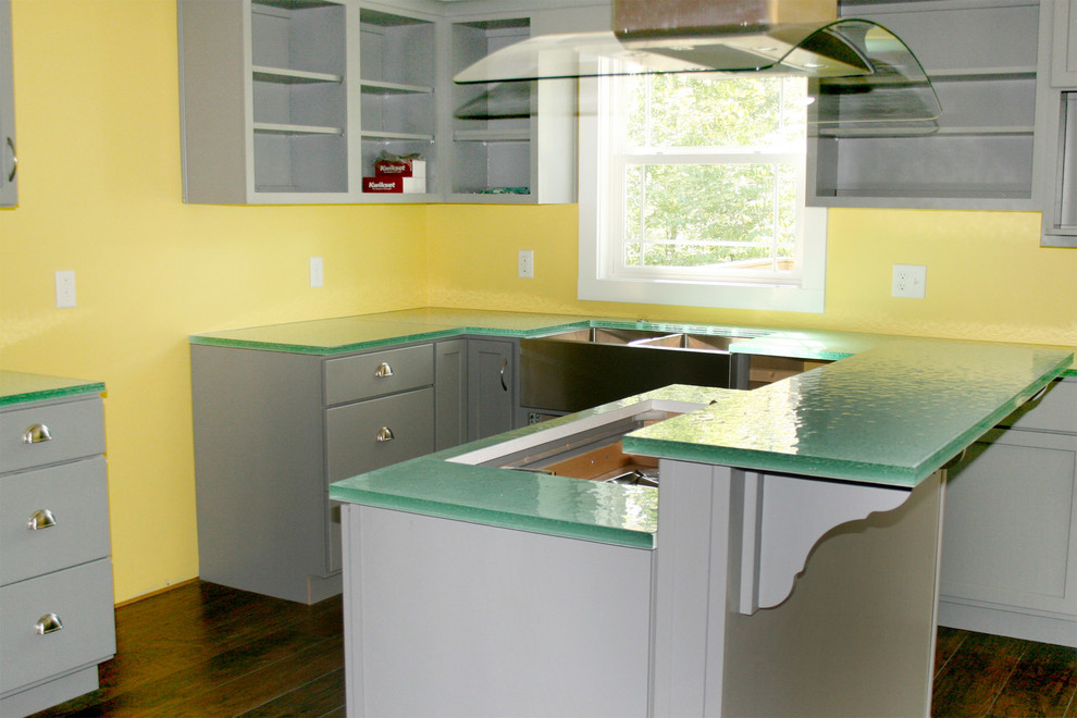 Inspiration for a mid-sized eclectic l-shaped eat-in kitchen in Louisville with a double-bowl sink, flat-panel cabinets, grey cabinets, glass benchtops, with island, brown floor, green benchtop and dark hardwood floors.