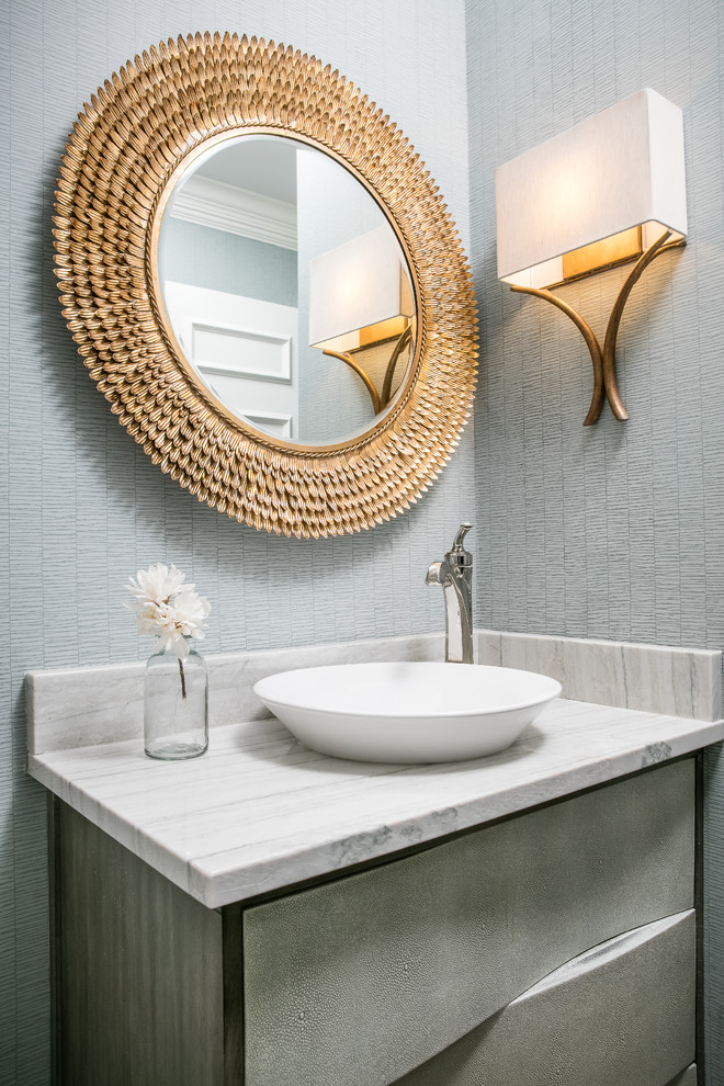 Photo of a transitional powder room in Kansas City with furniture-like cabinets, grey cabinets, grey walls and a vessel sink.