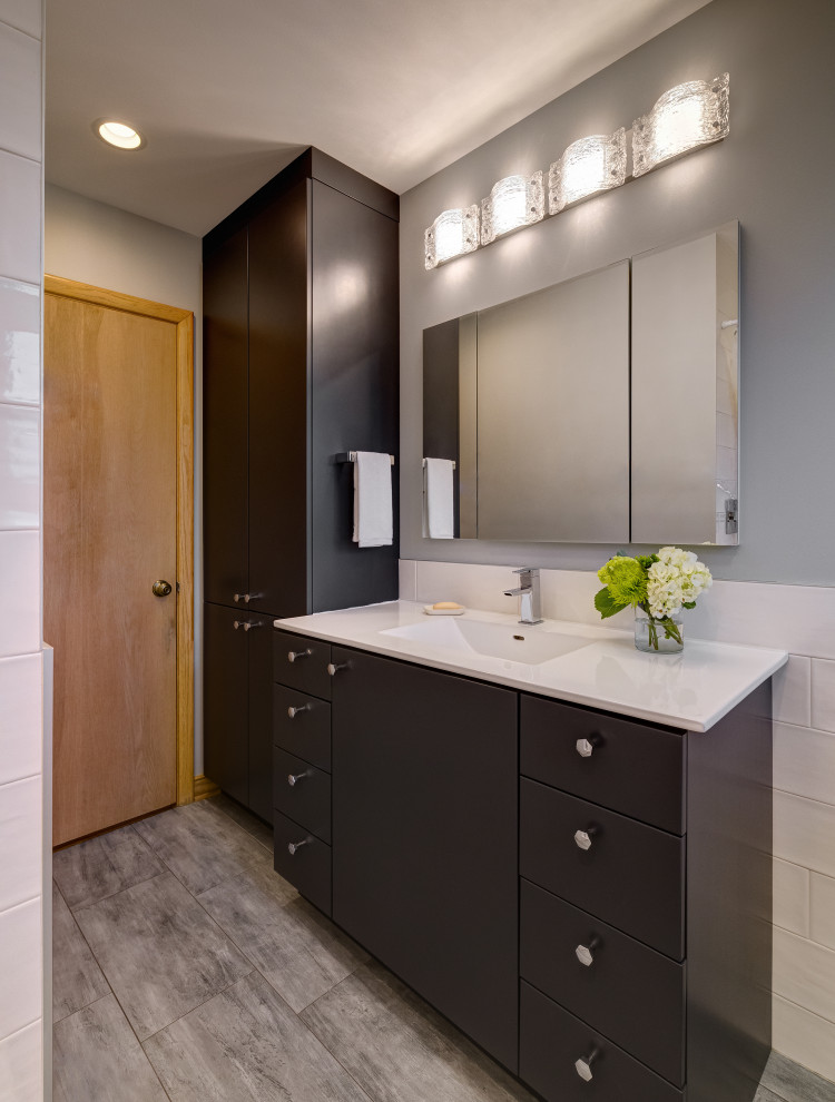 Inspiration for a mid-sized contemporary 3/4 bathroom in Chicago with flat-panel cabinets, brown cabinets, white tile, porcelain tile, grey walls, porcelain floors, an integrated sink, grey floor, white benchtops, a single vanity and a built-in vanity.