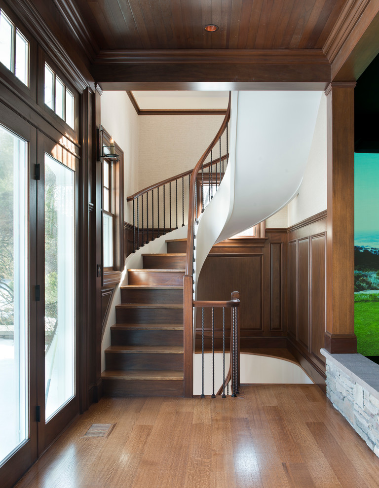 Inspiration for a transitional wood staircase in Boston with wood risers.