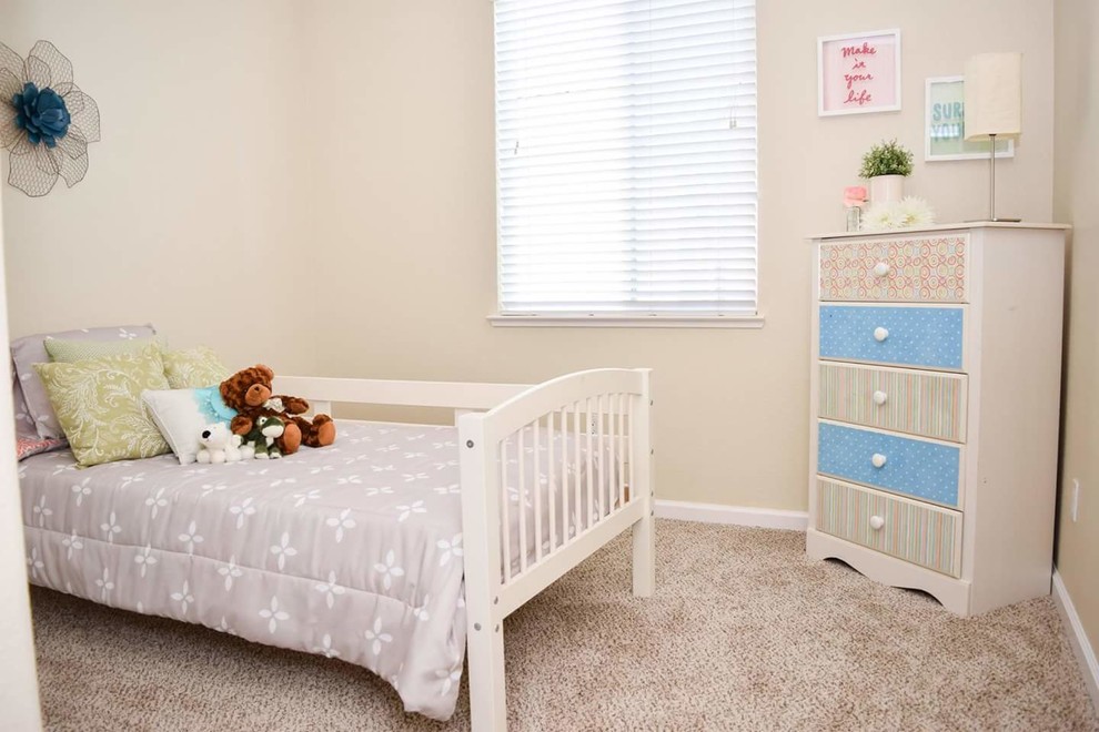 Design ideas for a small traditional kids' bedroom for kids 4-10 years old and girls in Sacramento with beige walls, carpet and beige floor.