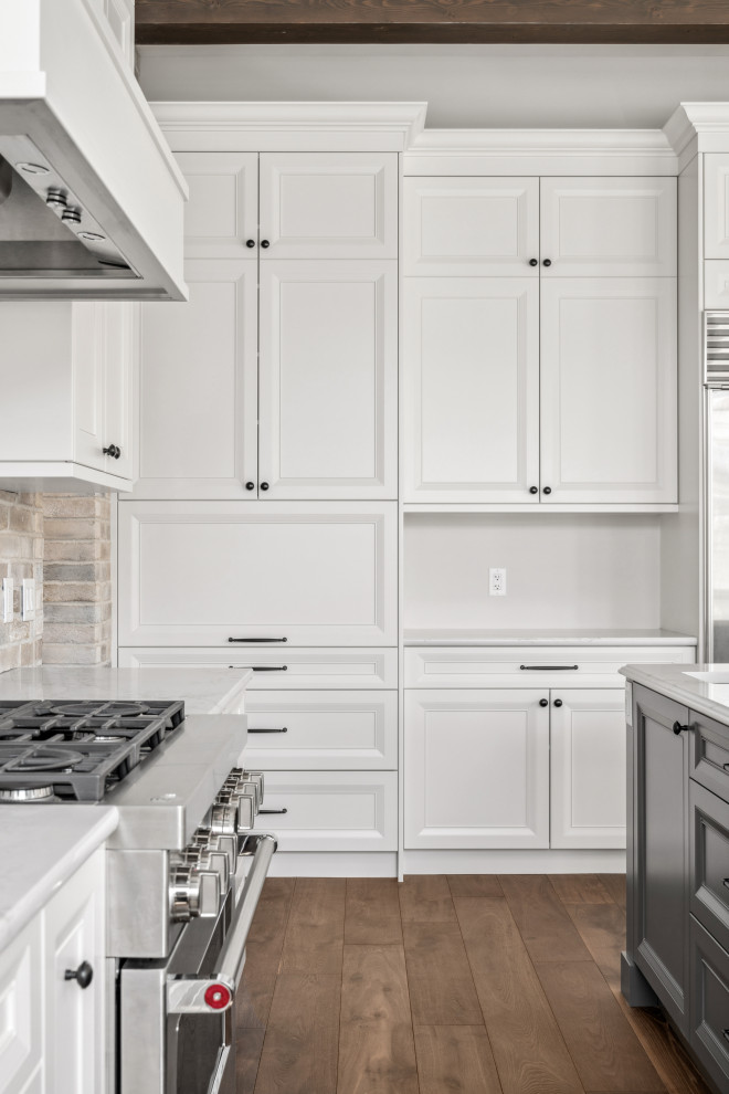Example of a transitional kitchen design in Calgary