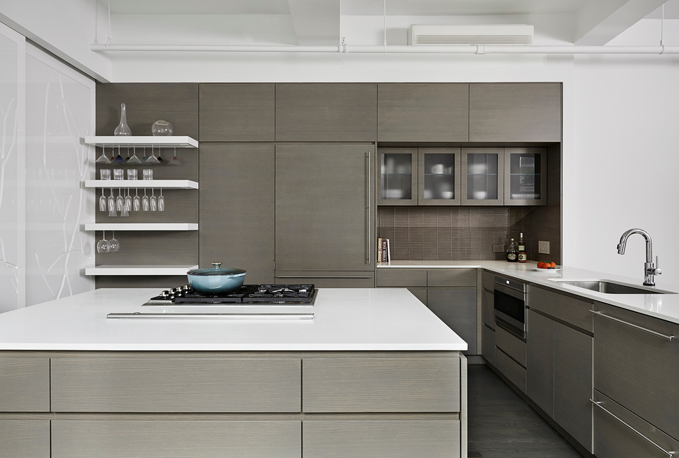 This is an example of a large contemporary l-shaped eat-in kitchen in New York with flat-panel cabinets, dark wood cabinets, with island, an undermount sink, brown splashback, stainless steel appliances, quartz benchtops, matchstick tile splashback and painted wood floors.